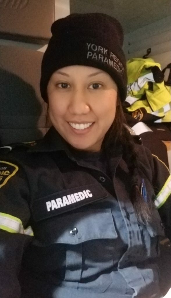 Paramedic Marivic Luchico in an ambulance
