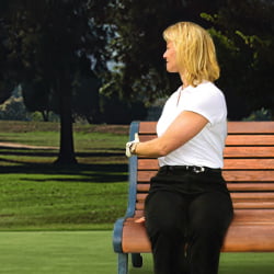 A woman demonstrating a seated twist stretch