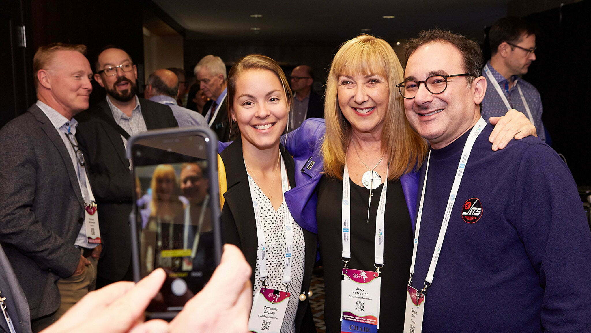 Bezeau, Forrester, Olin taking a photo together