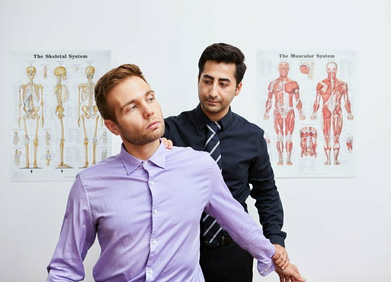 Chiropractor with a patient