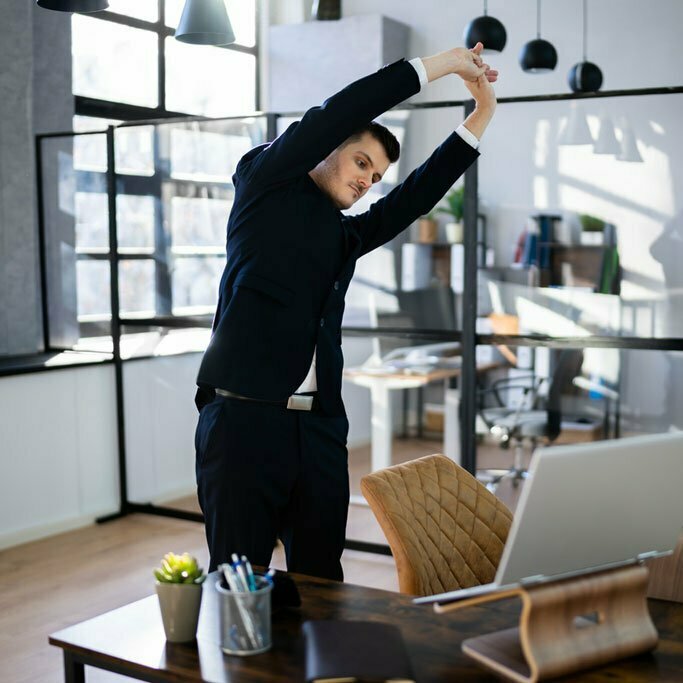 Man stretching at work