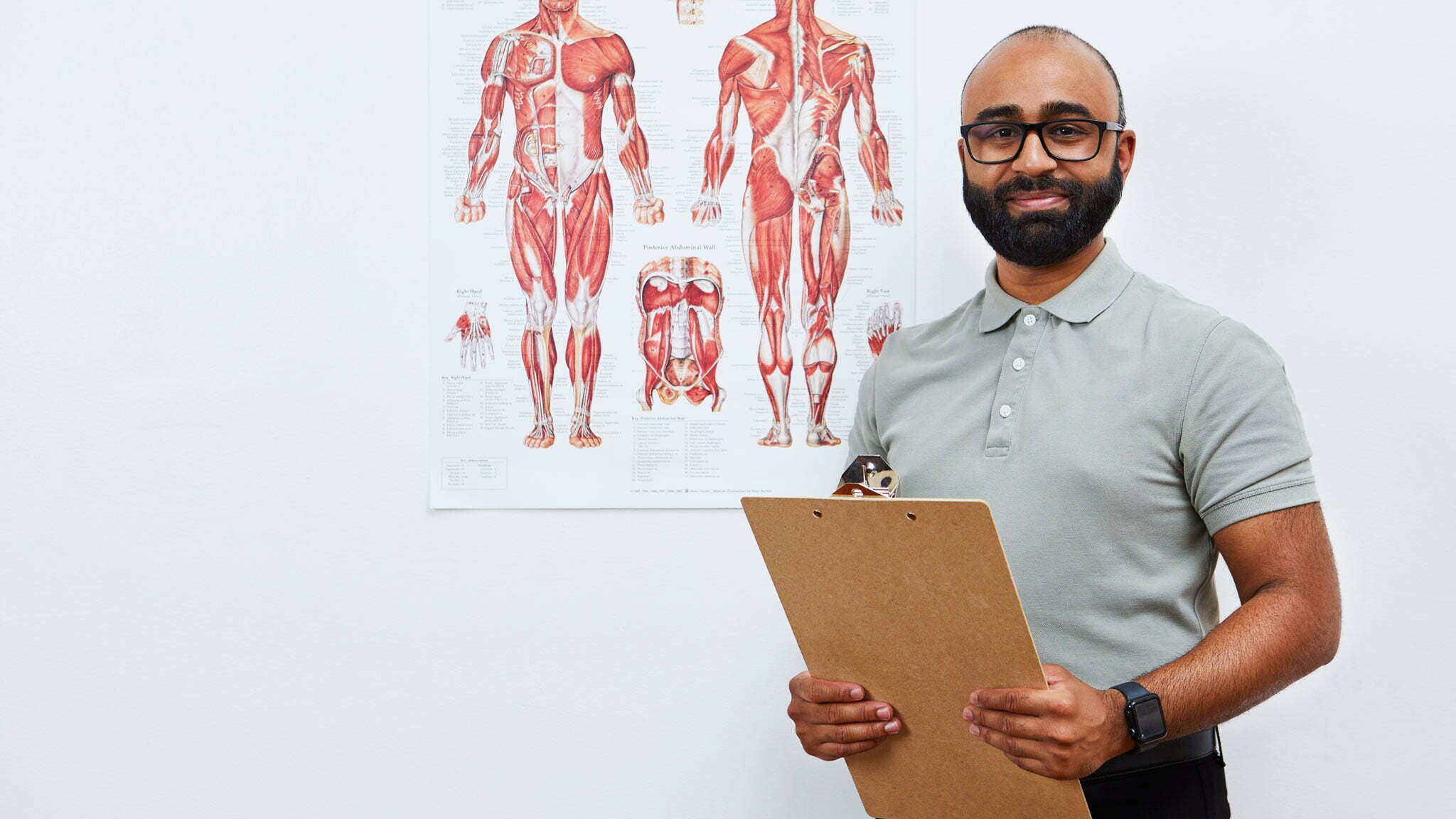 Chiropractor holding a clipboard