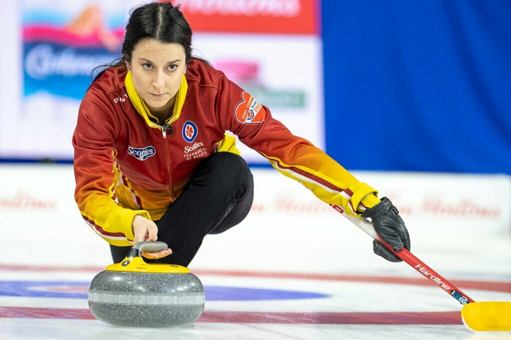 Dr. Brigitte MacPhail curling