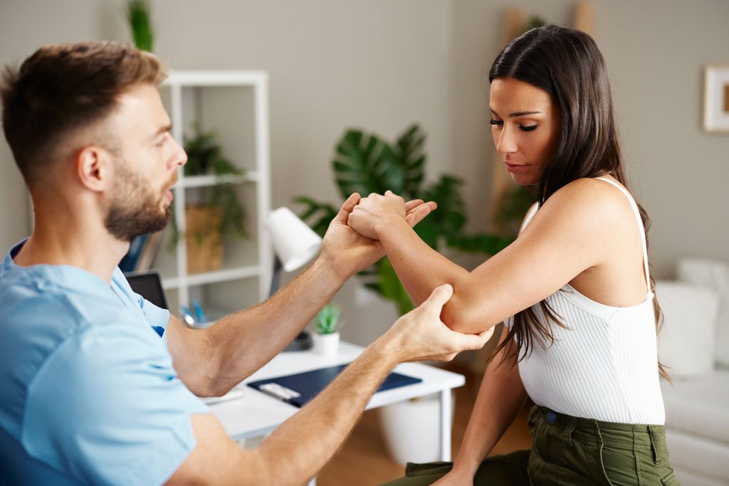 Chiropractor with a patient